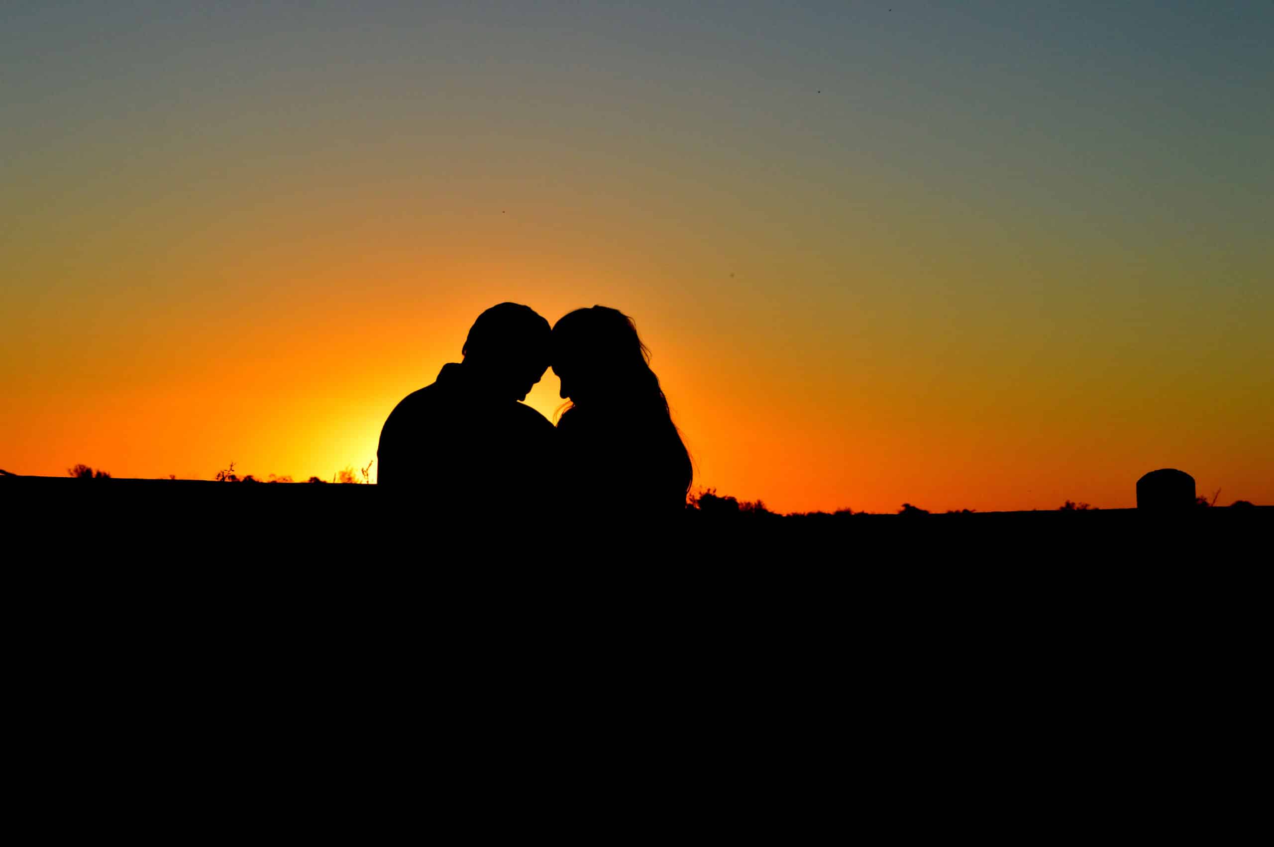 Sunset photo of couple in dark silhouette